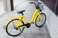 Yellow-colored bicycle `Ofo bike sharing` is dockless Ofo system uses a smartphone app to unlock bicycles.